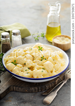 Cauliflower with cheese sauce Cauliflower with cheese sauce 104730671