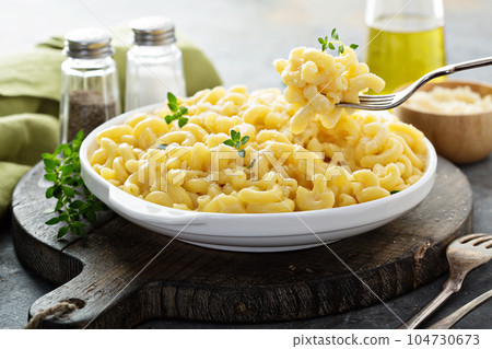 Macaroni and cheese on a white plate Macaroni and cheese on a white plate 104730673
