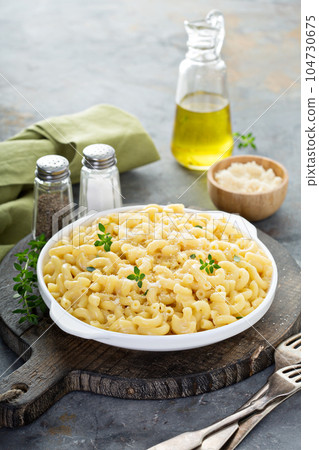 Macaroni and cheese on a white plate 104730675