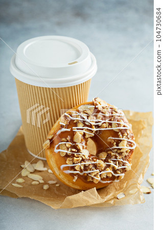 Almond and caramel glazed donut with cherry 104730684
