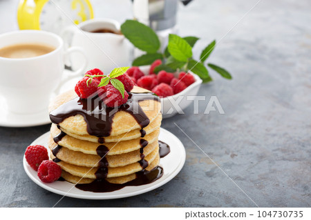 Stack of fluffy buttermilk pancakes with chocolate 104730735