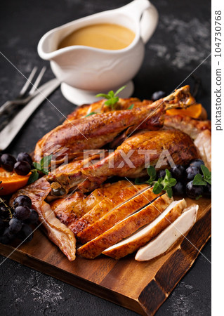 Carved turkey on a cutting board 104730768