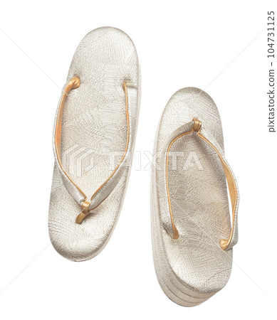 Tabis footwear shoes Japanese Traditional Komono equipment fly in air. Tabis footwear shoes Japanese Traditional Komono is beautiful clothes for ceremony event. White background isolated 104731125