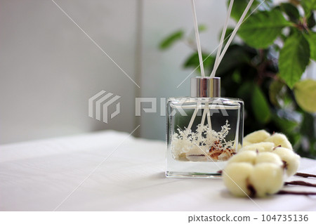 Clear glass bottle diffuser with sea shells and cotton fragrance concept 104735136