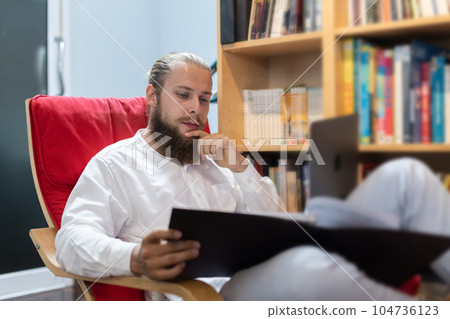 Businessman caucasian with beard using laptop. Businessman caucasian with beard using laptop. 104736123