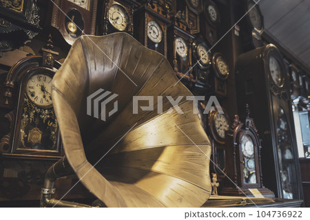 Gramophone and many old wall clocks Gramophone and many old wall clocks 104736922