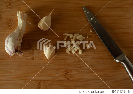 Garlic on wooden background 104737966