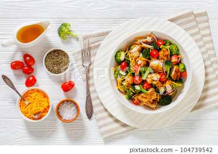 fried chicken tenders broccoli salad in bowl fried chicken tenders broccoli salad in bowl 104739542
