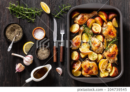 Lemon Garlic Chicken with roast potatoes, top view Lemon Garlic Chicken with roast potatoes, top view 104739545