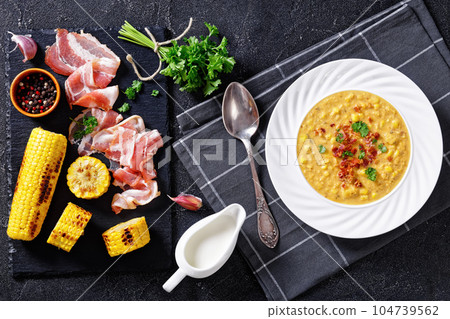 corn chowder in bowl on table, top view corn chowder in bowl on table, top view 104739562