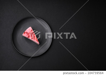 Delicious sweet dessert cheesecake with raspberry and pistachio flavor Delicious sweet dessert cheesecake with raspberry and pistachio flavor 104739564