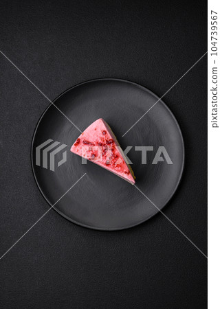 Delicious sweet dessert cheesecake with raspberry and pistachio flavor Delicious sweet dessert cheesecake with raspberry and pistachio flavor 104739567