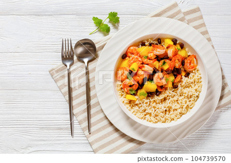 shrimps with beans, mango, brown rice in bowl shrimps with beans, mango, brown rice in bowl 104739570