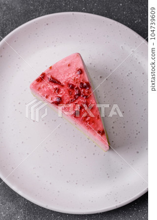 Delicious sweet dessert cheesecake with raspberry and pistachio flavor Delicious sweet dessert cheesecake with raspberry and pistachio flavor 104739609
