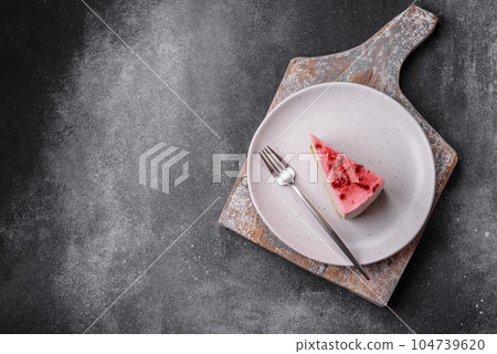 Delicious sweet dessert cheesecake with raspberry and pistachio flavor Delicious sweet dessert cheesecake with raspberry and pistachio flavor 104739620