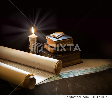 Still life from ancient books with candles 104740145