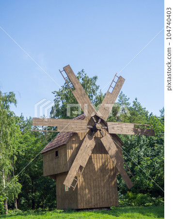 wooden windmill in summer wooden windmill in summer 104740403