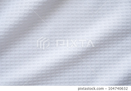 White sports clothing fabric football shirt jersey texture abstract background White sports clothing fabric football shirt jersey texture abstract background 104740632