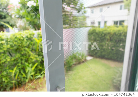 mosquito net wire screen on house window protection against insect 104741364