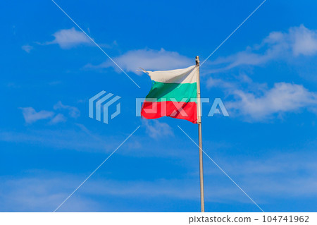 Waving flag of Bulgaria against blue sky Waving flag of Bulgaria against blue sky 104741962
