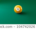 Billiard ball number one isolated on the green table 104742026