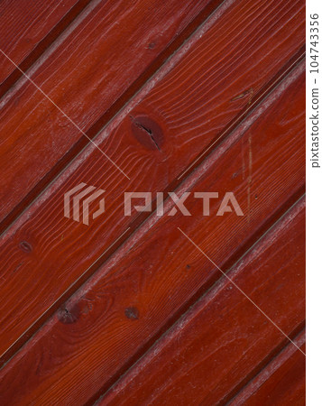 image of old boards with diagonal red paint 104743356