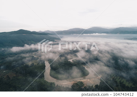Aerial view canal river in tropical rainforest with morning fog Aerial view canal river in tropical rainforest with morning fog 104743412