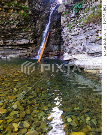 the Bukhtivets waterfall in the Carpathian Mountains 104743602