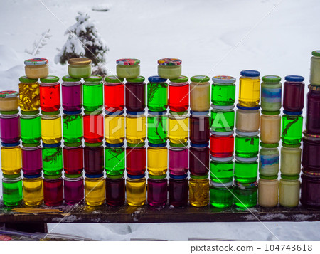 Jars of sweet honey with natural additives 104743618