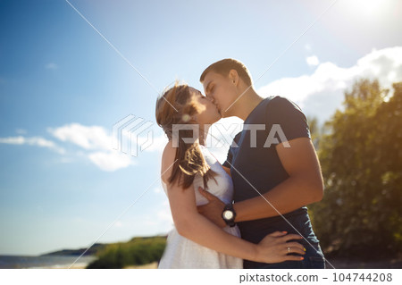 Couple in love enjoying tender moments during sunset . Emotional concept of relationship. 104744208