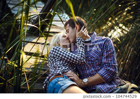 Couple in love enjoying tender moments during sunset . Emotional concept of relationship. 104744529