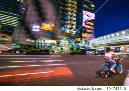 Tokyo cityscape in Japan Dangerous driving and impact of bicycles! Hello where are you running? = In front of Shibuya Station 104745840