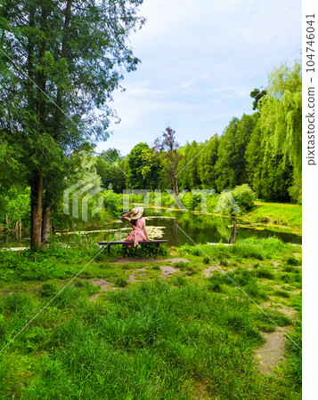woman traveler enjoying of relaxing with lake view woman traveler enjoying of relaxing with lake view 104746041