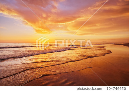 Atlantic ocean sunset with surging waves at Fonte da Telha beach, Costa da Caparica, Portugal Atlantic ocean sunset with surging waves at Fonte da Telha beach, Costa da Caparica, Portugal 104746650