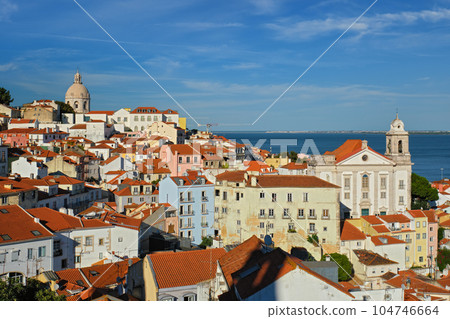 View of Lisbon famous postcard iconic view from Miradouro de Santa Luzia tourist viewpoint over Alfama old city district. Lisbon, Portugal. 104746664