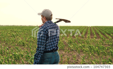 farmer shovel corn field, work field with shovel, smile face portrait farmer, farming shovel, male wheat organic boots soil hiking harvest vegetable ecological grass farming walk sun farmland food 104747303