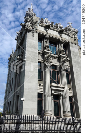 Kiev, Ukraine June 10, 2021: The facade of the building "House with Chimeras" its architectural decoration with sculptures and sculptures of animals and demons 104749860