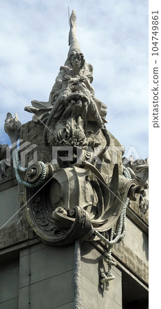Kiev, Ukraine June 10, 2021: The facade of the building "House with Chimeras" its architectural decoration with sculptures and sculptures of animals and demons 104749861