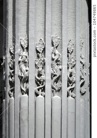 Kiev, Ukraine June 10, 2021: The facade of the building "House with Chimeras" its architectural decoration with sculptures and sculptures of animals and demons 104749865