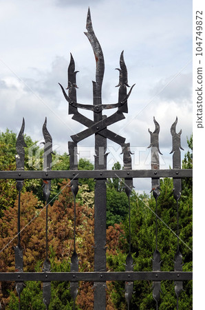 Kiev, Ukraine June 10, 2021: The facade of the building "House with Chimeras" its architectural decoration with sculptures and sculptures of animals and demons 104749872