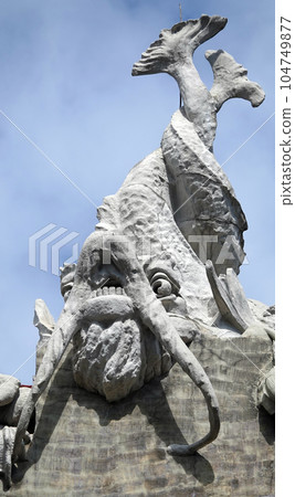 Kiev, Ukraine June 10, 2021: The facade of the building "House with Chimeras" its architectural decoration with sculptures and sculptures of animals and demons 104749877