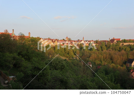 Germany, Rothenburg, Old town cityscape seen from Burg Park (spring, sunset) Germany, Rothenburg, Old town cityscape seen from Burg Park (spring, sunset) 104750047