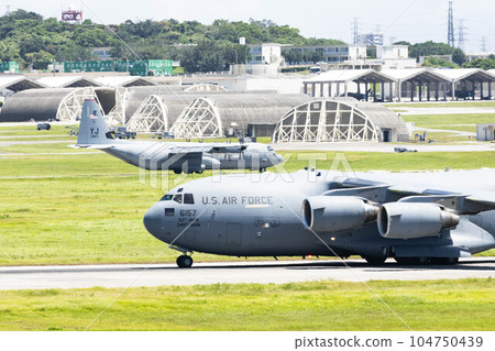 Kadena Air Base runway and US aircraft Kadena Air Base runway and US aircraft 104750439