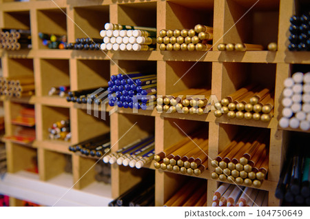 Close-up shot. A large assortment of various graphite pencils in different softness for sale in school stationery store 104750649
