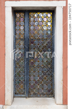 Vintage wooden door with glass windows 104750717