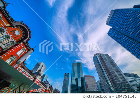 Tokyo cityscape in Japan Sunny day in the rainy season. A view of the blue sky (looming dark clouds) and Tokyo Station and buildings = July 6 104751145