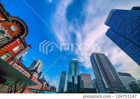 Tokyo cityscape in Japan Sunny day in the rainy season. A view of the blue sky (looming dark clouds) and Tokyo Station and buildings = July 6 104751147