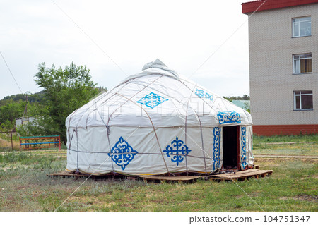 traditional Kazakh yurt house in courtyard 104751347