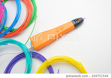 3d Pen. Printing with Colored Plastic Wire Filament. Child making a Christmas Three, Heart shape drawing with 3D pen. Artwork, Robotics. STEAM, STEM education. Modern Technologies. Study at home 104751544