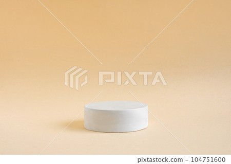 Podium for cosmetic product presentation. Abstract minimal geometrical form. Cylinder podium sphere, geometric forms, soft shadow. Scene to show products. Showcase, display case. Flat lay, side view Podium for cosmetic product presentation. Abstract minimal geometrical form. Cylinder podium sphere, geometric forms, soft shadow. Scene to show products. Showcase, display case. Flat lay, side view 104751600